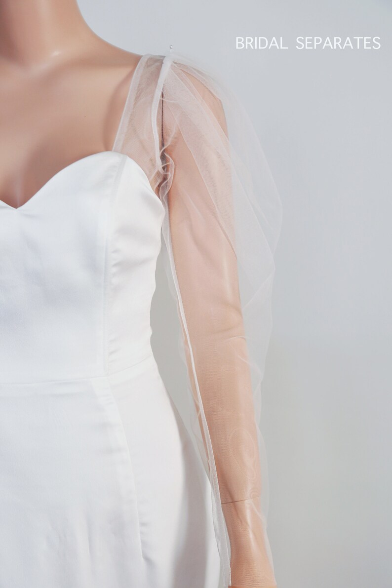 May include: White bridal separates with a sweetheart neckline and sheer tulle puff sleeves. The text "BRIDAL SEPARATES" is visible in the top right corner of the image.