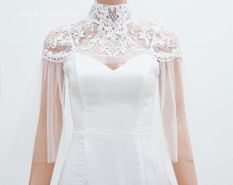 May include: White bridal lace bolero with a high neck and sheer sleeves. The bolero is made of delicate lace and tulle.