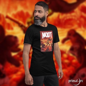 Puede incluir: Una camiseta negra con un estampado gráfico de un personaje de videojuego sosteniendo un arma. El texto "NOOT" está impreso en blanco sobre el personaje.