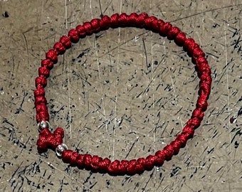 red prayer rope with clear beads