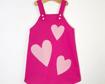 Pink love heart pinafore dress