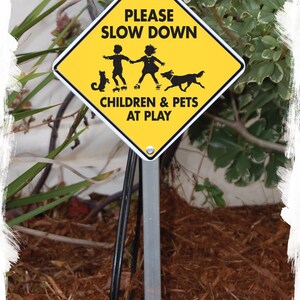 Caution! Please Slow Down Children and Pets at Play Aluminum Dog Sign ...