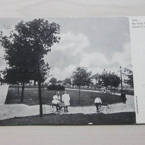 Vintage postcard, real photo, two children in Bay Side Park, Jersey City, c1900, tricycles, children's costume, social history