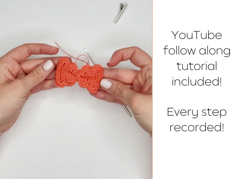 May include: A coral colored crocheted bow with a white crochet hook. The text "YouTube follow along tutorial included! Every step recorded!" is visible in the image.