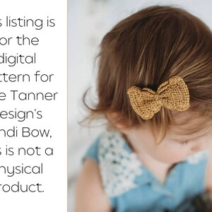 May include: A close-up of a child's head with a crocheted mustard yellow bow in their hair. The bow is tied in a simple knot and is centered on the top of the head.