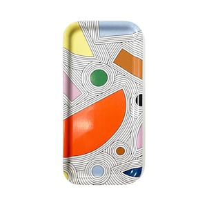 May include: A rectangular tray with a white background and a colorful geometric pattern. The pattern includes orange, yellow, green, blue, brown, and pink shapes with black lines.