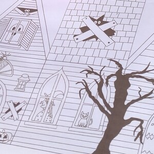 Completed printable in 2D haunted house showcasing how the right side and back looks upclose . It features detailed Halloween elements including a witch, alien, large door, and a large tree.