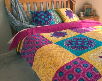 Bespoke, patchwork bedspread,  with bright colour panels and kantha stitch.