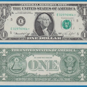 May include: A one dollar bill with a portrait of George Washington on the front and the words "The United States of America" and "One Dollar" printed on it. The back of the bill features a pyramid with an eye at the top and the words "In God We Trust" printed on it.