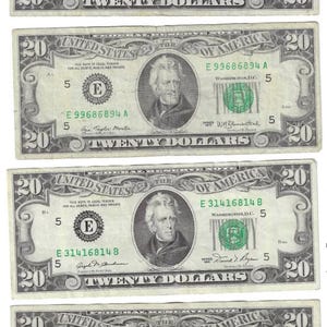 May include: Four twenty dollar bills featuring Andrew Jackson. The bills are from different series years, 1969, 1977, 1990, and 1991. Each bill has a unique serial number.