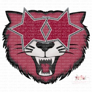 Peut inclure: Un visage de tigre de dessin animé rouge et noir avec une expression féroce. Le tigre porte deux grandes étoiles rouges scintillantes sur les yeux.