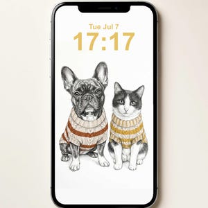 A smartphone displaying a digital illustration of a French Bulldog and a cat sitting side-by-side, both wearing cable-knit sweaters. The screen shows the date Tue Jul 7 and the time 17:17 in a gold font against a white background.