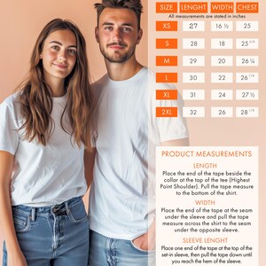 May include: Size chart for a white t-shirt with measurements in inches for XS, S, M, L, XL, and 2XL. The chart shows the length, width, and chest measurements for each size. The chart also includes instructions for measuring the length, width, and sleeve length of the shirt.