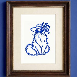 A framed art print featuring a blue ink illustration of a Maine Coon cat on a white background. Cat is wearing sunglasses and a Kentucky Derby Hat.