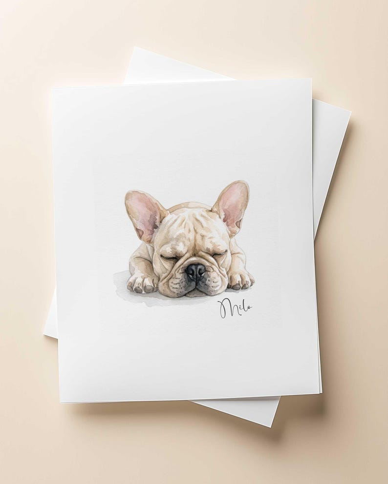 May include: A watercolor illustration of a fawn-colored French Bulldog puppy sleeping with its head resting on its front paws. The dog has large ears and a black nose. The name Milo is written in cursive script in the bottom right corner of the art.