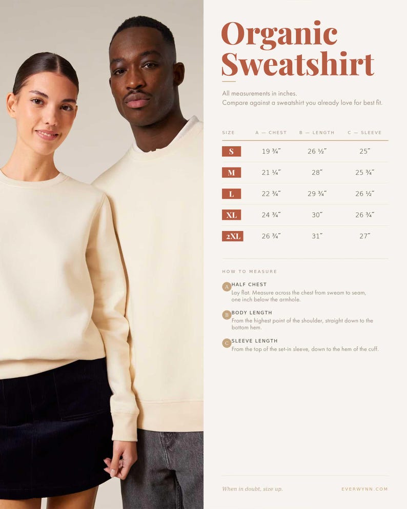 May include: A cream-colored crewneck sweatshirt shown on two individuals, accompanied by a size chart titled Organic Sweatshirt. The chart lists measurements in inches for sizes S through 2XL, including chest, length, and sleeve length details.