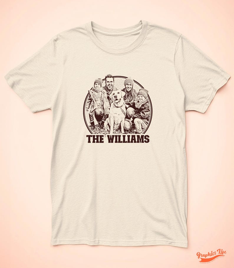 May include: A beige t-shirt featuring a brown circular graphic of a family and their dog. The text "THE WILLIAMS" is printed beneath the circle.