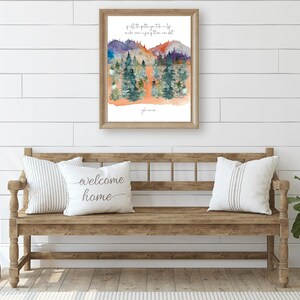 jon mur quote art printable of all the paths yu take in lif mak sur a few of them are dirt cursiv font on white portrat orientd natur wal art with watrcolr art of pine tree forest and colorful mtns in green purpl orange blue yelo and gray in entrywa