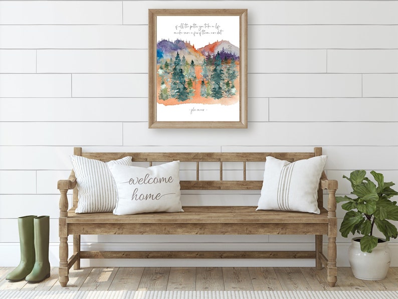 jon mur quote art printable of all the paths yu take in lif mak sur a few of them are dirt cursiv font on white portrat orientd natur wal art with watrcolr art of pine tree forest and colorful mtns in green purpl orange blue yelo and gray in entrywa