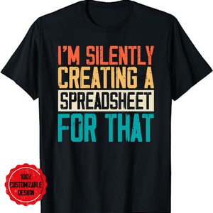 May include: A black t-shirt with a vintage-style graphic that reads "I'm silently creating a spreadsheet for that".