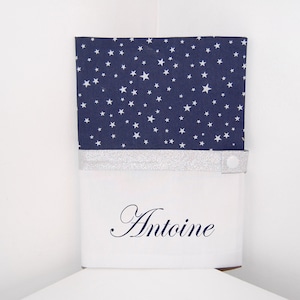 Protects PERSONALISABLE health book in navy blue fabric and white star pattern, ideal birth gift