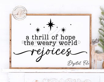 May include: A white sign with a brown wood frame features a black and white graphic with the text "a thrill of hope the weary world rejoices". The graphic includes three stars. The text "Digital File" is in the bottom right corner.