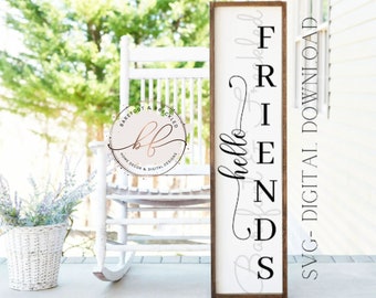 May include: A wooden sign with the words "hello friends" in black script. The sign is rectangular with a dark brown frame and a white background. A white rocking chair and a basket of lavender are in the background.