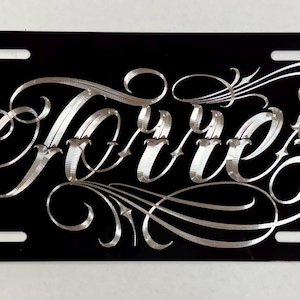 May include: A white ceramic mug with a black handle and the text "But First, Coffee" in a bold, black font. The mug is set against a plain white background, highlighting its simple design.