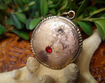 old gilded pendant.