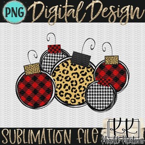 May include: Five Christmas ornaments in a cluster. The ornaments are decorated with red and black plaid, black and white houndstooth, and leopard print patterns.
