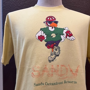 Vintage anni &#39; 90 Sands Oceanfront Resorts Sandy Yellow T Shirt Taglia L
