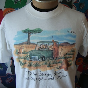 Vintage The FAR SIDE Drive George Drive This ones got a coat hanger Gary Larson Sunday Newspaper Surrealist Comedy Comic Strip T Shirt XL