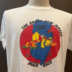 Camiseta branca vintage dos anos 80 The Great New Jersey Duck Race tamanho L