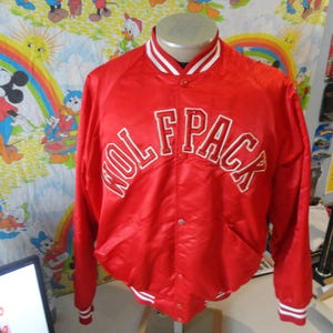 May include: Red satin bomber jacket with white ribbed trim and a white embroidered "Wolfpack" logo on the front.