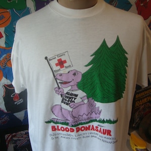 Vintage 1980’s Blood Donor “Donasaurus Dinosaur T Shirt XL