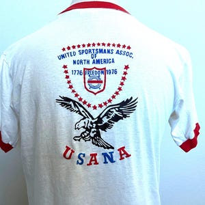 Vintage 70er Jahre Rückendruck United Sportsmans Assoc. von Nordamerika 1776 1976 USANA T Shirt Gr. L Bild 1