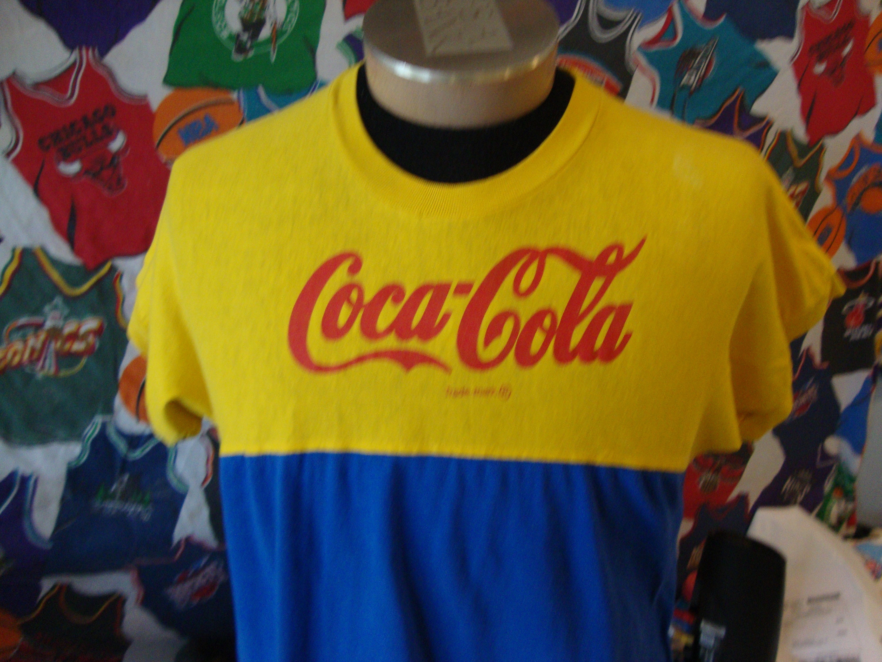 Yellow coca cola shirt 2025