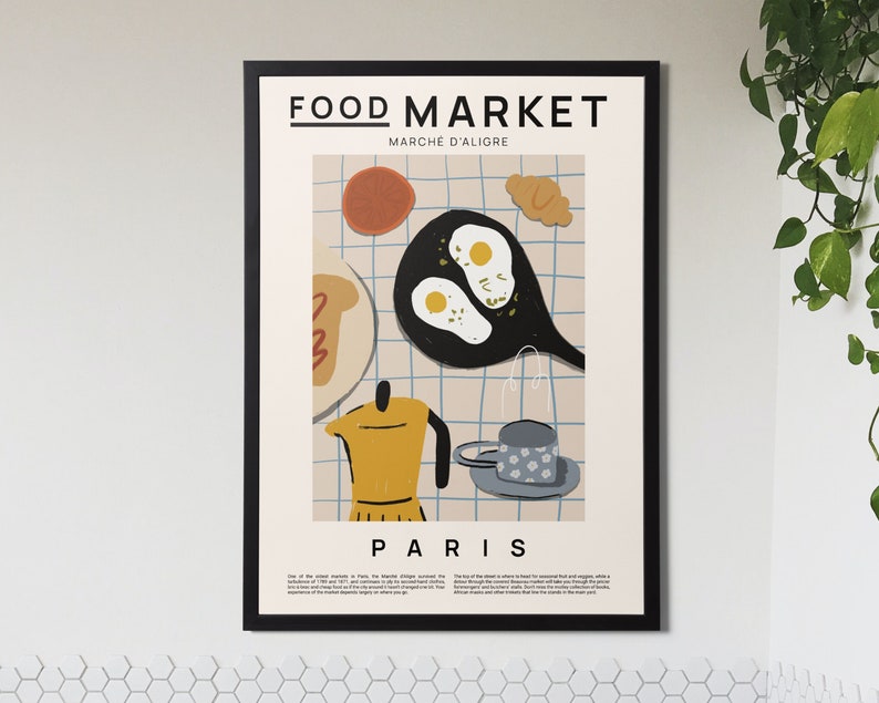 May include: A black and white illustration of a Parisian food market with the text "FOOD MARKET MARCHE D'ALIGRE PARIS". The illustration features a frying pan with eggs, a coffee pot, a cup of coffee, and a croissant.
