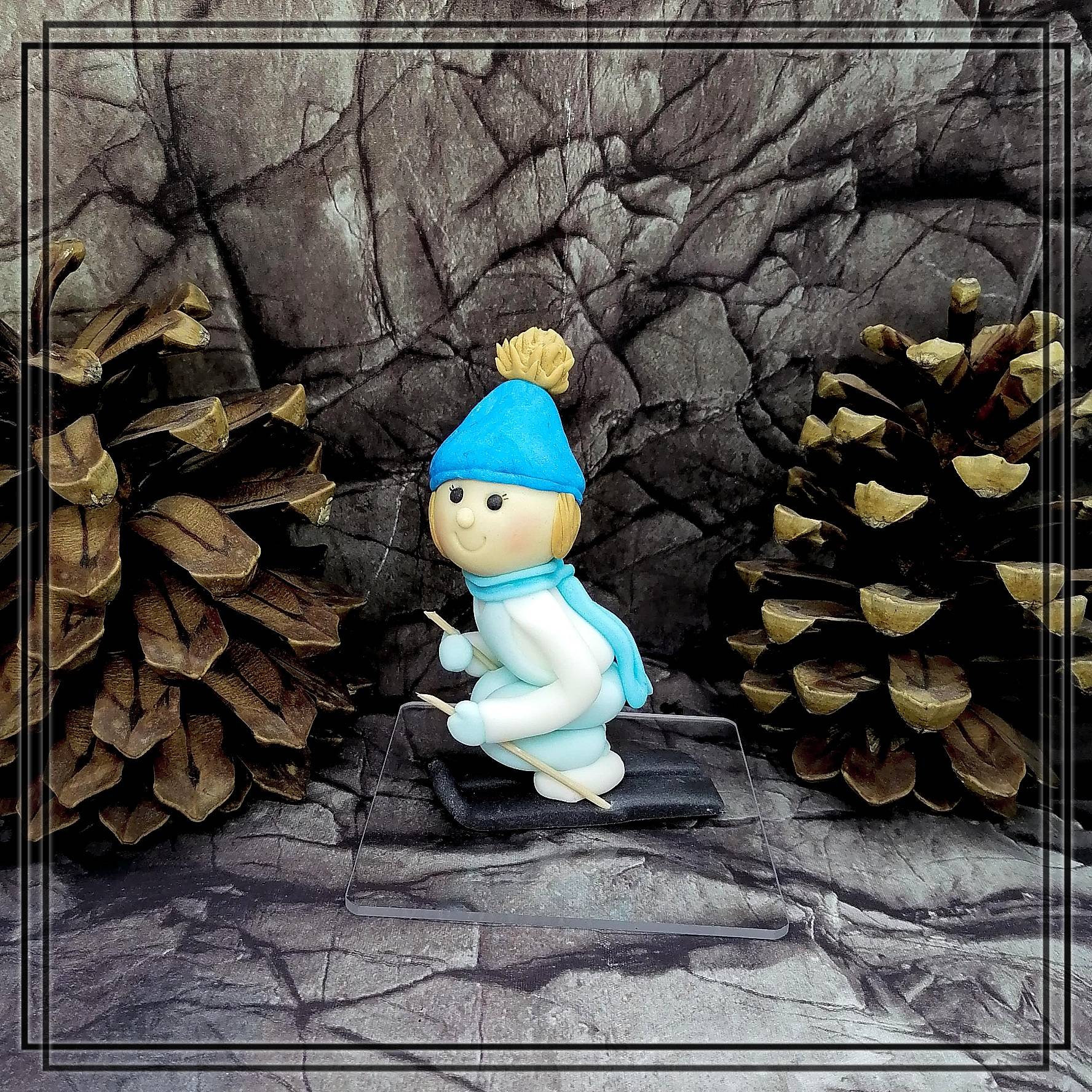 Skier fondant figure as cake decoration