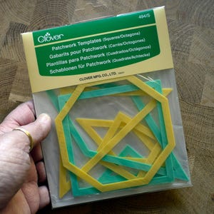 May include: A pack of Clover brand patchwork templates for squares and octagons. The clear plastic packaging contains multiple yellow and green geometric plastic shapes. The header card features the text Clover, Patchwork Templates, and 494/S.