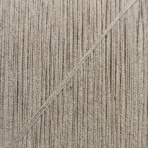 May include: Close-up of a beige woven fabric with a single, diagonal, lighter beige thread running across the surface.