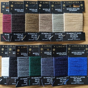 May include: Assortment of 10-meter spools of wool/nylon mending thread in various colors. Each spool is labeled with "Wool/Nylon for Mending" and the length in meters and yards. The thread is 30% wool and 70% nylon.