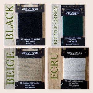 May include: Four spools of wool/nylon mending thread in black, beige, ecru, and bottle green. Each spool is labeled with the color, "Wool/Nylon for Mending", and the length in meters and yards. The brand name "Lincatex" is printed on the green spool.