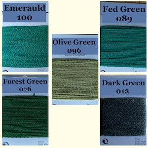 May include: Five rectangular cards of darning thread in various green shades. Labels include Emerauld 100, Fed Green 089, Olive Green 096, Forest Green 076, and Dark Green 012. Each card contains 15 metres of thread, with some labelled 55% wool and 45% nylon.