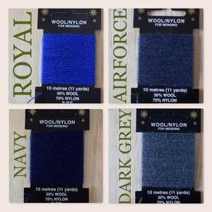 May include: Four spools of wool and nylon thread for mending, in colors navy, royal blue, dark grey, and airforce blue. Each spool is labeled with the color name, "Wool/Nylon for Mending", and the length in meters and yards.