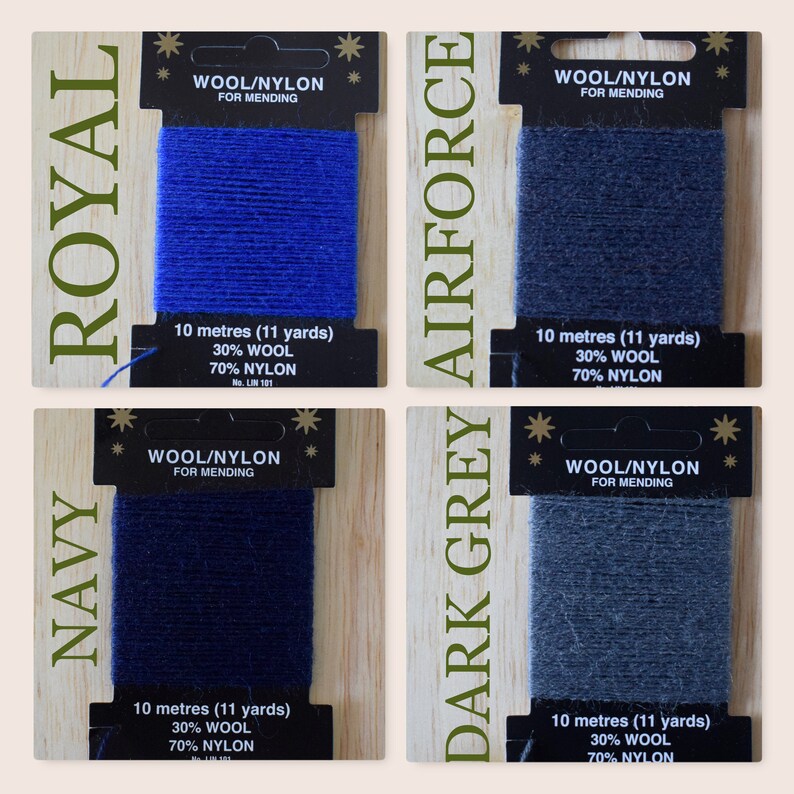 May include: Four spools of wool and nylon thread for mending, in colors navy, royal blue, dark grey, and airforce blue. Each spool is labeled with the color name, "Wool/Nylon for Mending", and the length in meters and yards.