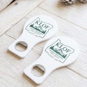 Custom logo bottle opener magnet displayed on an ivory rustic background, showcasing its high-quality print as a professional corporate business gift and branded event souvenir.