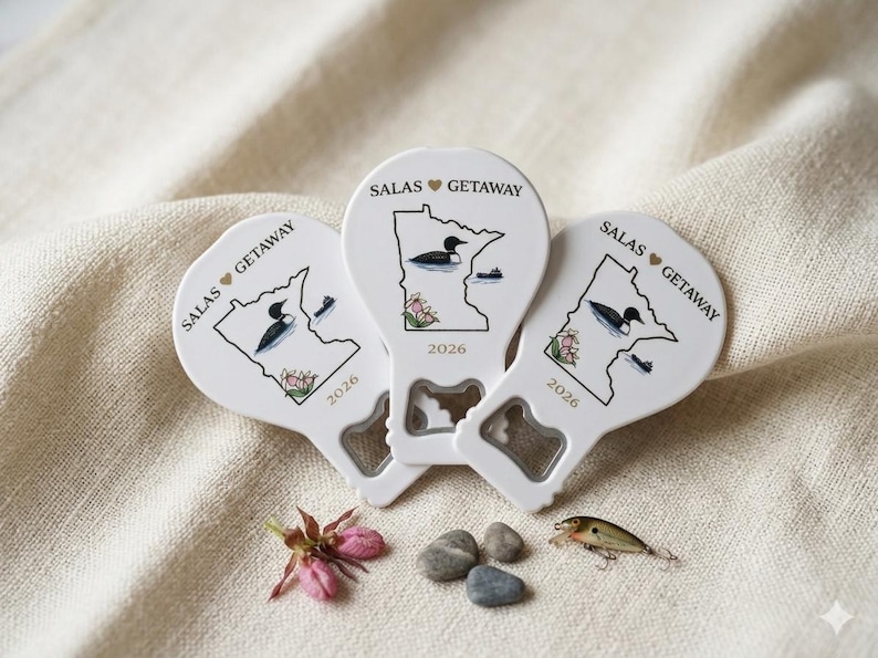 Back view of a state-shaped wedding favor revealing the heavy-duty metal bottle opener and strong magnet