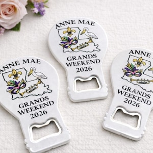 Vintage-inspired presentation of a custom logo bottle opener magnet, serving as a branded event souvenir and a professional realtor favor.
