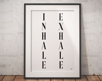 May include: Black and white framed print with the words "INHALE" and "EXHALE" written vertically in a minimalist style.